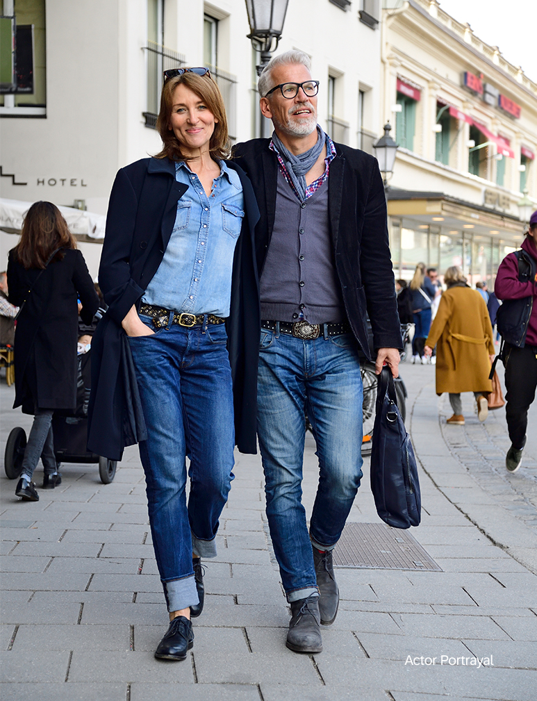 smiling woman and man walking in the city
